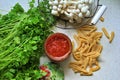 Tomato puree in a jar, pasta, parsley, shimeji mushrooms, ingredients for a pasta dish Royalty Free Stock Photo