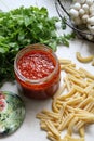 Tomato puree in a jar, pasta, parsley, shimeji mushrooms, ingredients for a pasta dish Royalty Free Stock Photo