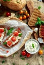 Tomato Ricotta Bruschetta with sun dried tomatoes paste, olive oil brown bread and basil Royalty Free Stock Photo