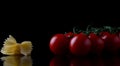 Tomato. Ripe natural tomatoe close-up. Organic tomato rotating on red background. Macro shot. Half of Tomato close-up. Garden, Royalty Free Stock Photo