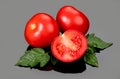 Tomato. Ripe natural tomatoes close-up. Organic tomato with leaves on gray background Royalty Free Stock Photo