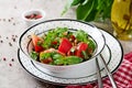 Tomato salad with basil and pine nuts in bowl - healthy vegetarian vegan diet organic food appetizer Royalty Free Stock Photo