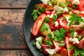 Tomato salad with feta cheese, spring onion and parsley. Healthy summer food Royalty Free Stock Photo