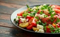 Tomato salad with feta cheese, spring onion and parsley. Healthy summer food Royalty Free Stock Photo