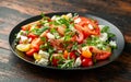 Tomato salad with feta cheese, spring onion and parsley. Healthy summer food Royalty Free Stock Photo