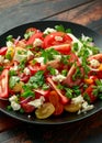 Tomato salad with feta cheese, spring onion and parsley. Healthy summer food Royalty Free Stock Photo