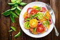 Tomato salad. Fresh vegetable salad with tomatoes, onion and basil