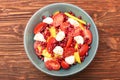 Tomato salad, mango and mozzarella with pomegranate seeds Royalty Free Stock Photo