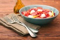 Tomato salad, mango and mozzarella with pomegranate seeds Royalty Free Stock Photo