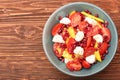 Tomato salad, mango and mozzarella with pomegranate seeds Royalty Free Stock Photo