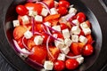 tomato salad with red onion and white cheese