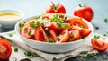 Tomato salad with spring onion and herbs in white bowl. Healthy summer food Royalty Free Stock Photo