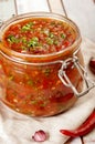 Tomato salsa in a glass jar Royalty Free Stock Photo