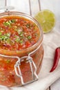 Tomato salsa in a glass jar Royalty Free Stock Photo