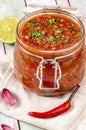 Tomato salsa in a glass jar Royalty Free Stock Photo