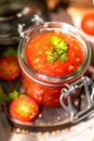 Tomato salsa in a glass jar Royalty Free Stock Photo