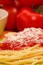 Tomato sauce spaghetti dish with parmiggiano cheese.