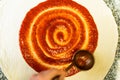 Tomato Sauce Swirl on PIzza Dough. Pizza Making Royalty Free Stock Photo