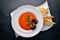 Tomato and seafood creamy soup with mussels.