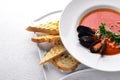 Tomato and seafood creamy soup with mussels.