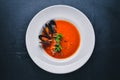 Tomato and seafood creamy soup with mussels