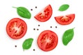 Tomato slices with basil and peppercorns isolated on white background. Clipping path and full depth of field. Top view Royalty Free Stock Photo