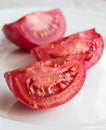 Tomato slices on a white background,