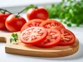 Tomato slices on a wood cutting board Royalty Free Stock Photo