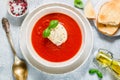 Tomato soup with mozzarella cheese, Basil and spices in a white plate. A thick, hearty dish, served with bread toast and olive oil Royalty Free Stock Photo