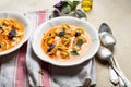 tomato soup with cappelletti pasta, cream and basil