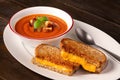 Tomato soup and grilled cheese sandwich with copy space