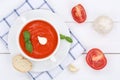 Tomato soup meal with tomatoes in bowl from above