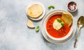 Tomato soup with mozzarella cheese, Basil and spices in a white plate. A thick, hearty dish, served with bread toast and olive oil Royalty Free Stock Photo