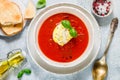 Tomato soup with mozzarella cheese, Basil and spices in a white plate. A thick, hearty dish, served with bread toast and olive oil Royalty Free Stock Photo