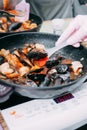 Tomato soup with mussels. The process of cooking tomato soup from mussels in a cooking class. Home-made food Royalty Free Stock Photo