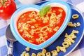 Tomato soup with pasta for child Royalty Free Stock Photo