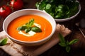 Tomato soup puree in a bowl with cream and fresh basil leaves Royalty Free Stock Photo