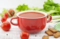 Tomato soup in red ceramic bowl on rustic wooden background. Hea Royalty Free Stock Photo