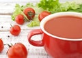 Tomato soup in red ceramic bowl on rustic wooden background. Hea Royalty Free Stock Photo