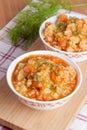 Tomato soup with rice and vegetables in a white saucepan Royalty Free Stock Photo