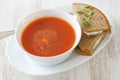 Tomato soup in white bowl with sandwich Royalty Free Stock Photo