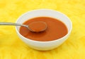 Tomato soup in white bowl with spoon Royalty Free Stock Photo