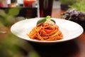 Italian pasta, pomodoro, bolognese, selective focus. Tomato spaghetti with cheese on a white plate, horizontal view. Royalty Free Stock Photo