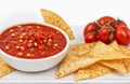 Tomato spicy salsa with chips, cut out isolated on white background Royalty Free Stock Photo
