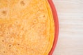 Tomato tortilla wraps on a plate top close view