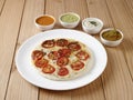 Tomato uthappam with sambar and chutneys an traditional South Indian food