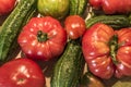 Tomatoe and cucumber wooden table bio organic backyard healthy outdoor produce germany macro closeup