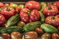 Tomatoe and cucumber wooden table bio organic backyard healthy outdoor produce germany macro closeup