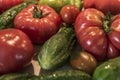 Tomatoe and cucumber wooden table bio organic backyard healthy outdoor produce germany macro closeup