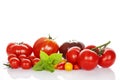 Tomatoes with basil isolated on white background Royalty Free Stock Photo